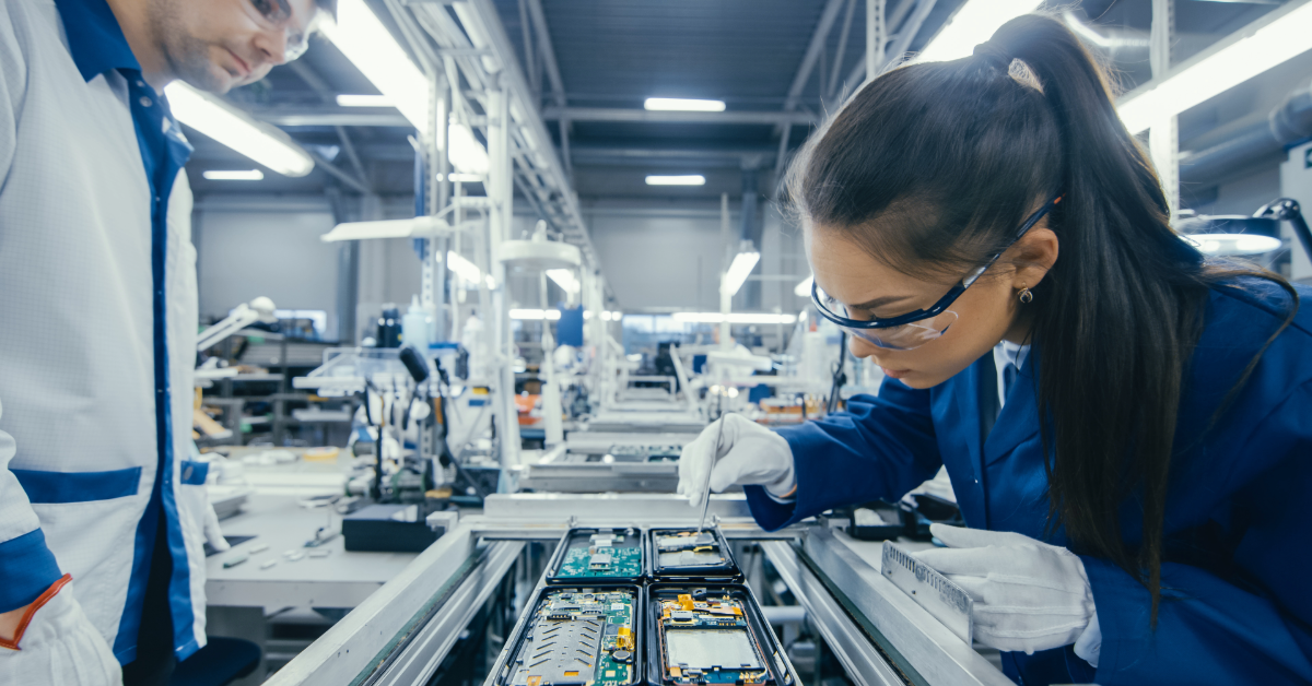 Woman and man working on a manufacturing line